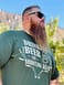 Man wearing the Big Daddy Drinking Beer Shooting Dear Graphic T-shirt in Forest Green